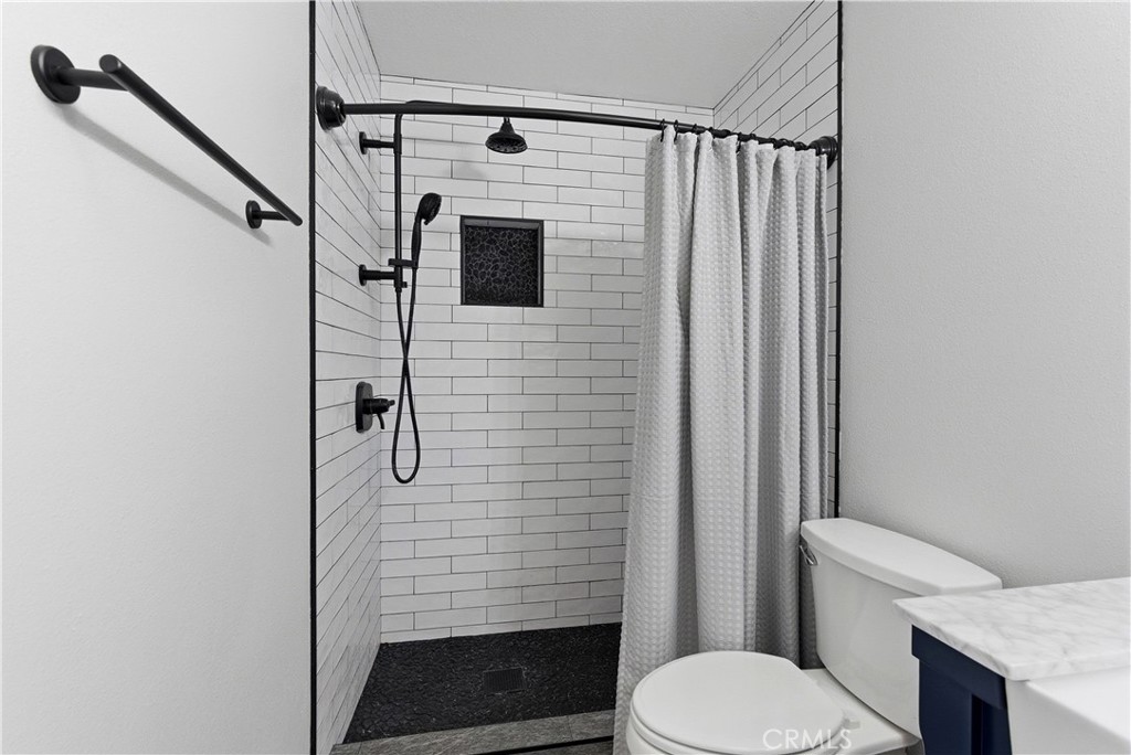 8070 East Oak Ridge Circle Anaheim Hills, CA 92808 - Photo 16 of 22 a bathroom with a toilet and a shower
