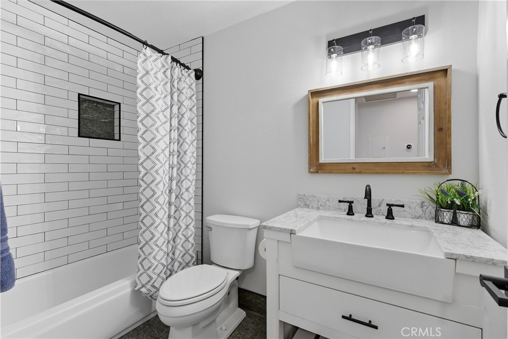 8070 East Oak Ridge Circle Anaheim Hills, CA 92808 - Photo 19 of 22 a bathroom with a toilet sink and mirror
