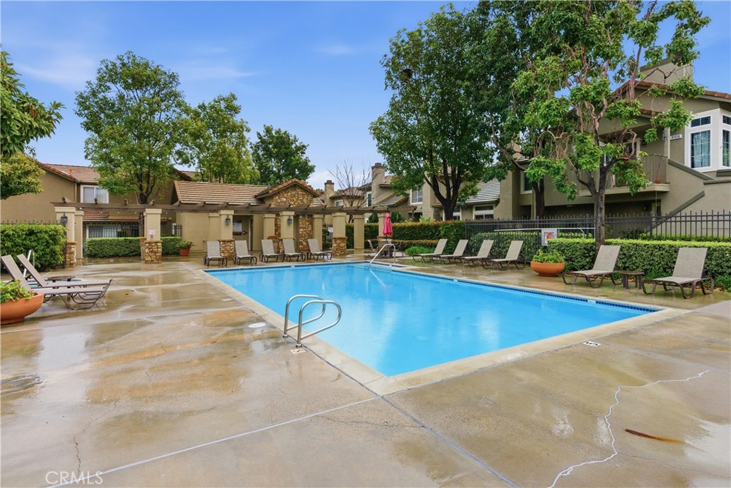 8070 East Oak Ridge Circle Anaheim Hills, CA 92808 - Photo 20 of 22 a view of a swimming pool with a lounge chair