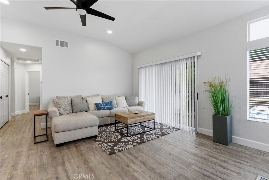8070 East Oak Ridge Circle Anaheim Hills, CA 92808 - Photo 3 of 22 a living room with furniture and a potted plant