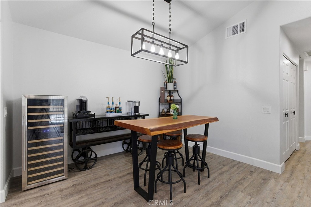8070 East Oak Ridge Circle Anaheim Hills, CA 92808 - Photo 5 of 22 a view of a dining room with furniture and wooden floor