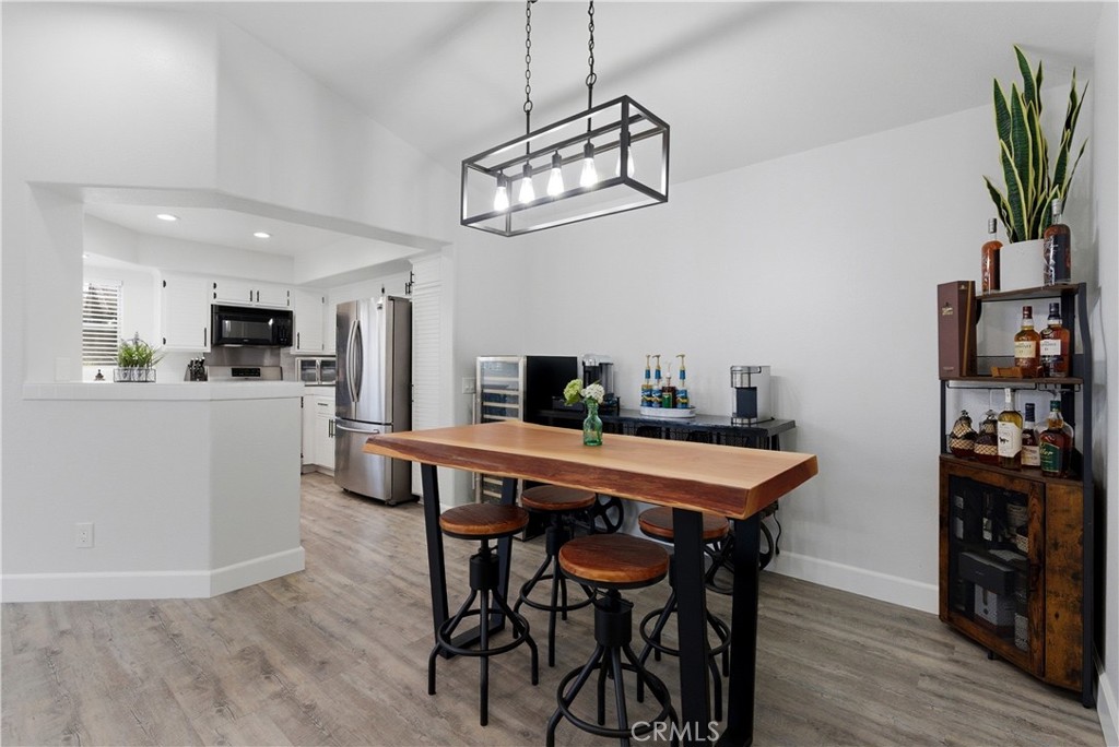 8070 East Oak Ridge Circle Anaheim Hills, CA 92808 - Photo 6 of 22 a dining room with furniture and wooden floor