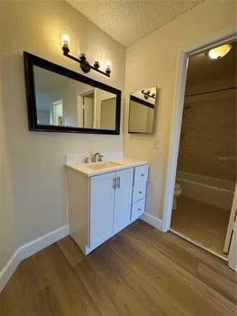 a view of cabinets and wooden floor