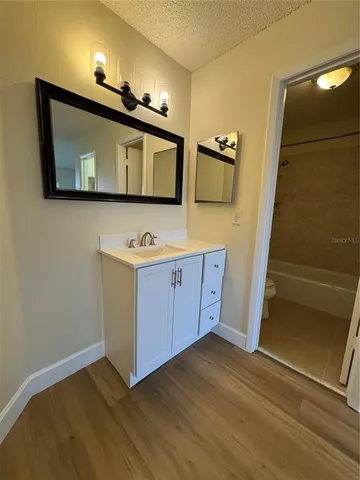 a view of cabinets and wooden floor