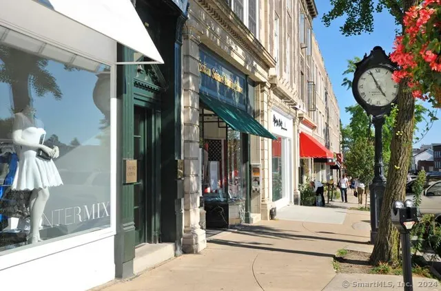 a view of a building with a tree in front of it
