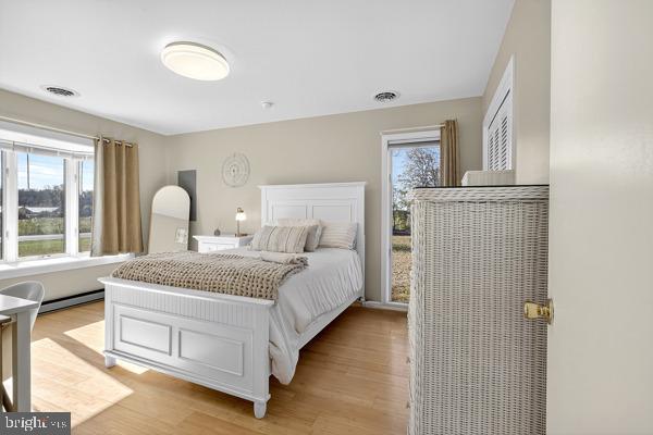 419 Williamsville Road Houston, DE 19954 - Photo 21 of 65 a bedroom with a bed and a window