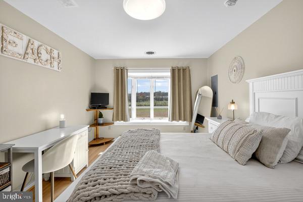 419 Williamsville Road Houston, DE 19954 - Photo 24 of 65 a bedroom with a large bed and a window