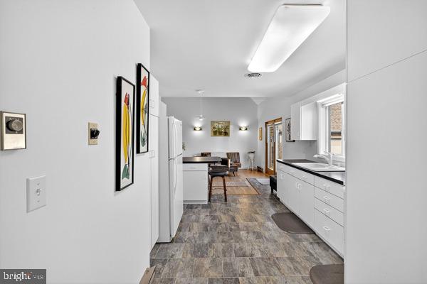 419 Williamsville Road Houston, DE 19954 - Photo 28 of 65 a kitchen with stainless steel appliances granite countertop a refrigerator and a sink