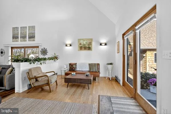 a view of entryway with wooden floor and stairs