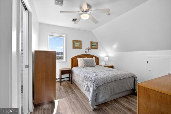 419 Williamsville Road Houston, DE 19954 - Photo 45 of 65 a bedroom with a bed and wooden floor