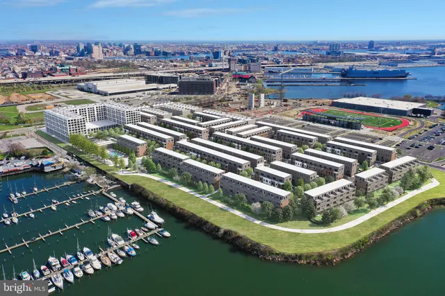 a view of a lake with a building and a big yard