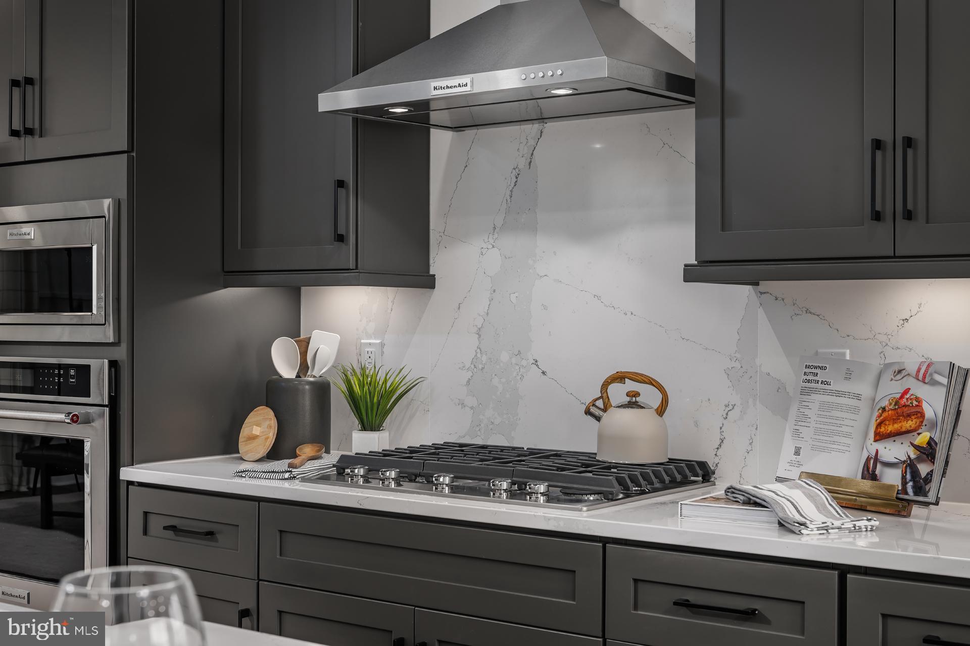 227 Light Street Baltimore, MD 21230 - Photo 5 of 29 a kitchen with stainless steel appliances granite countertop a sink and cabinets