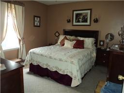 6771 Lovel Cook Road Springfield, TN 37172 - Photo 11 of 18 a bedroom with a bed and wooden floor