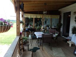6771 Lovel Cook Road Springfield, TN 37172 - Photo 16 of 18 a view of a patio with table and chairs and potted plants