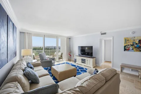 a kitchen with a sink a refrigerator and cabinets