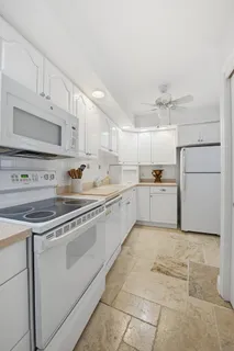 a bedroom with a bed next to a large window
