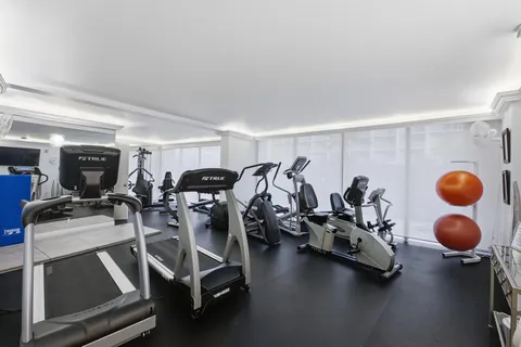 a view of a tall building with a swimming pool