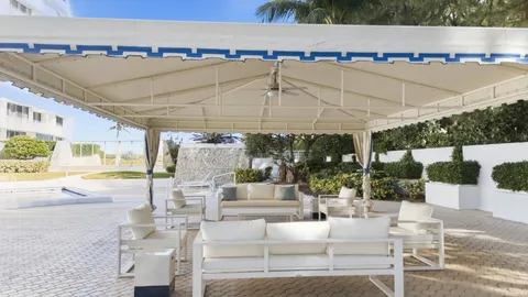 an aerial view of a house with a ocean view