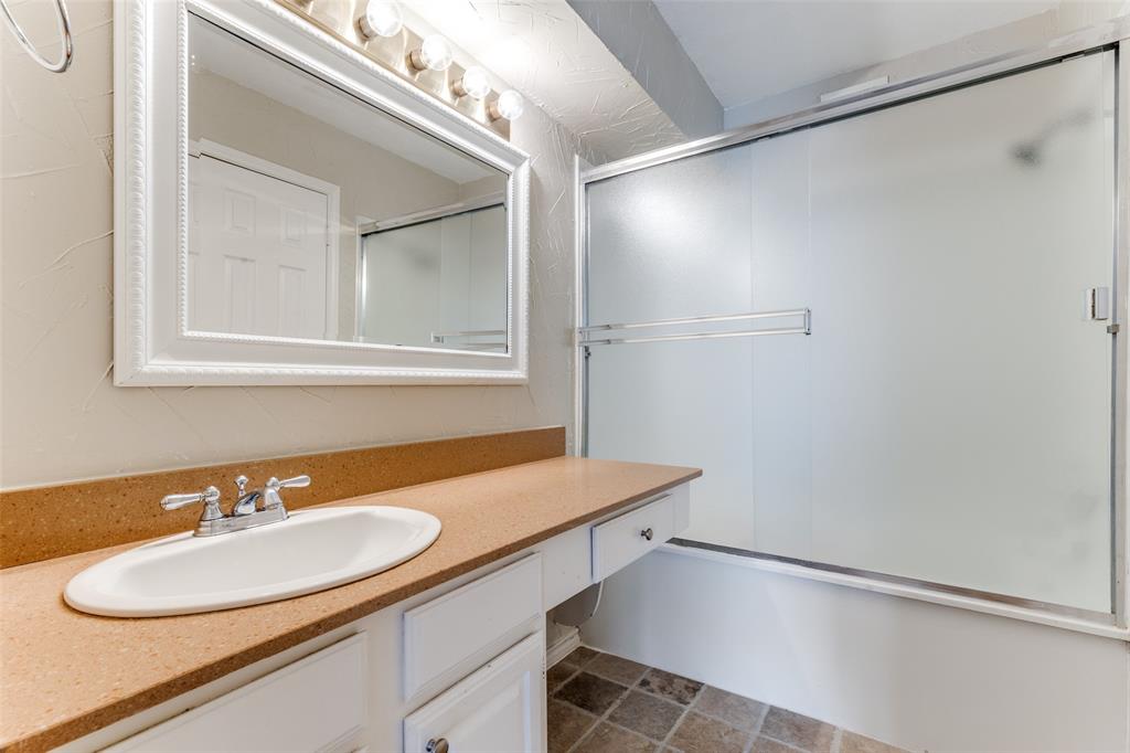 5565 Preston Oaks Road, Unit 237 Dallas, TX 75254 - Photo 7 of 14 a bathroom with a sink and a mirror