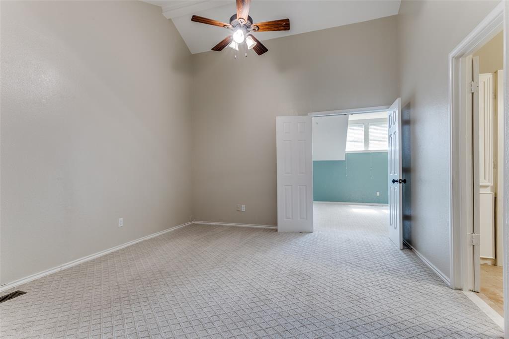 5565 Preston Oaks Road, Unit 237 Dallas, TX 75254 - Photo 8 of 14 a view of a room with a ceiling fan and carpet
