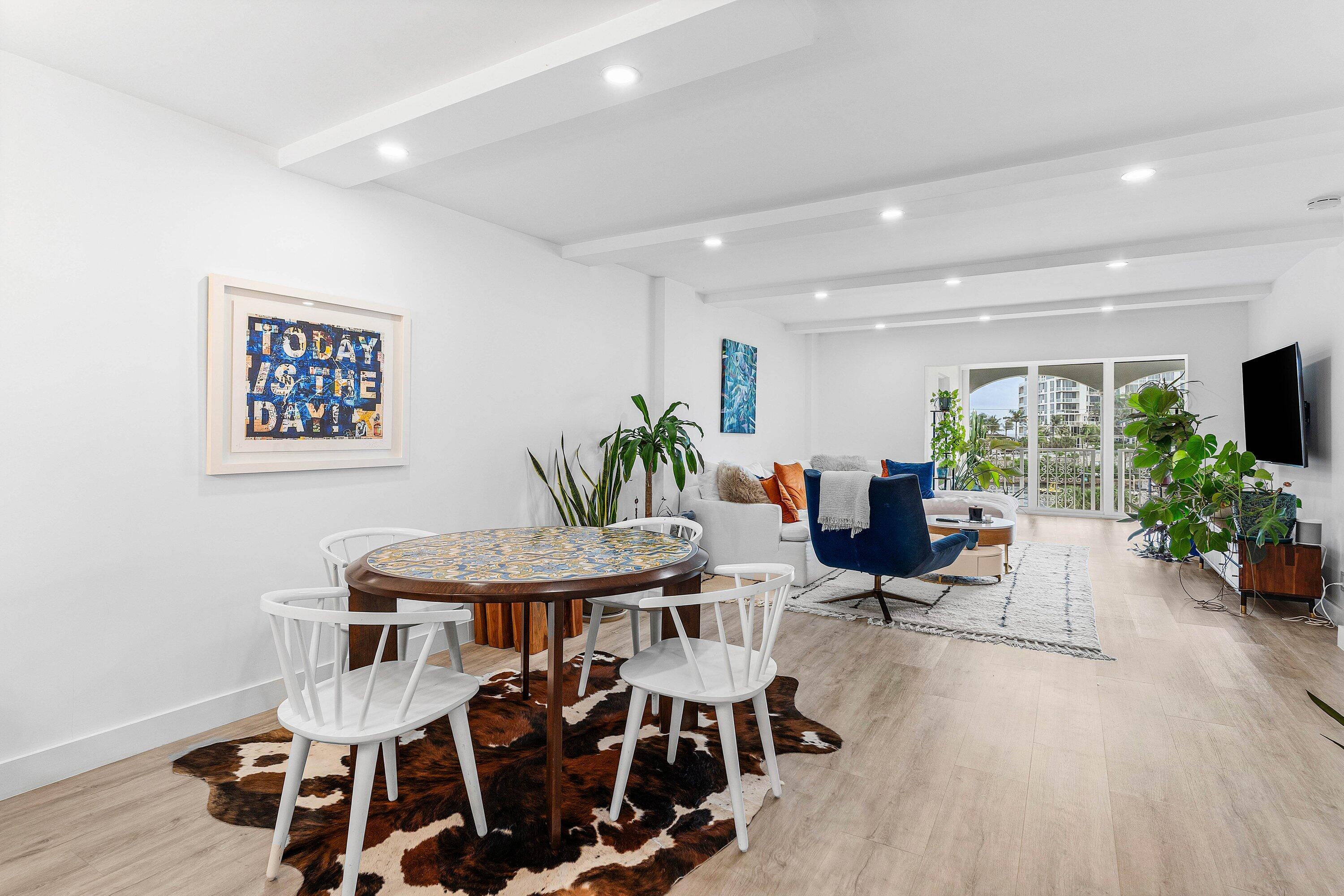 1001 East Camino Real, Unit 4040 Boca Raton, FL 33432 - Photo 11 of 44 a living room with furniture and a large window