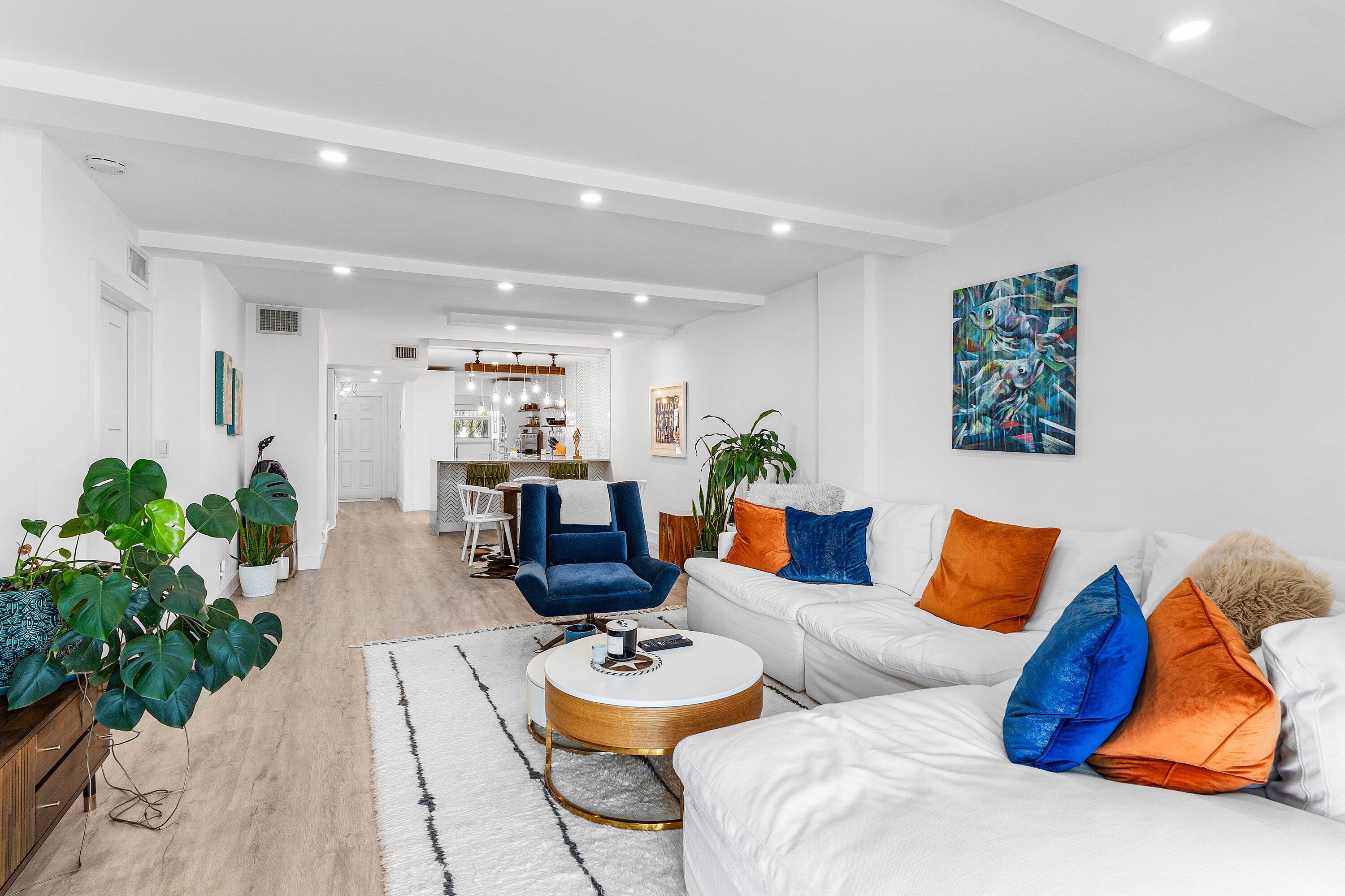 1001 East Camino Real, Unit 4040 Boca Raton, FL 33432 - Photo 15 of 44 a living room with furniture and wooden floor