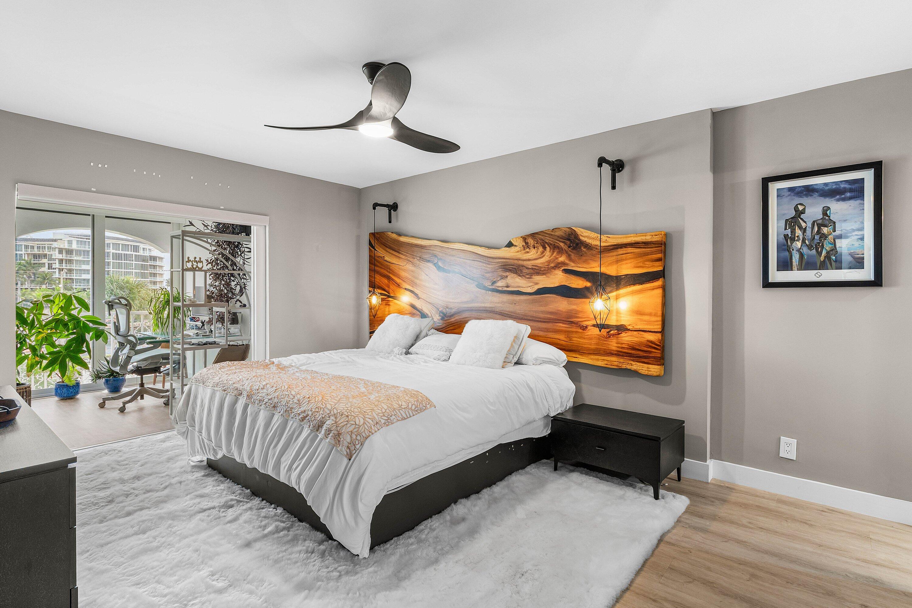 1001 East Camino Real, Unit 4040 Boca Raton, FL 33432 - Photo 16 of 44 a bedroom with a bed and potted plant