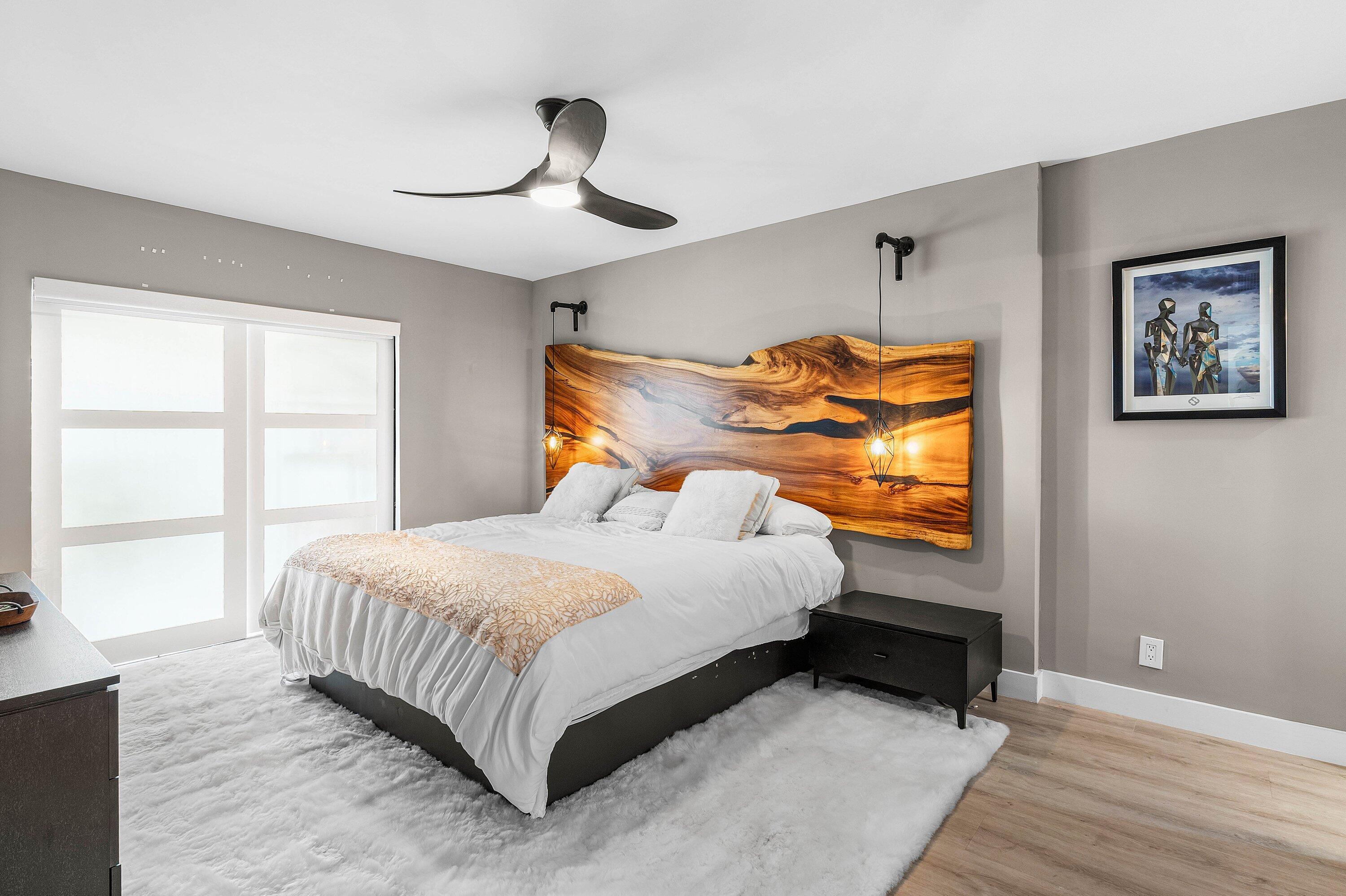 1001 East Camino Real, Unit 4040 Boca Raton, FL 33432 - Photo 17 of 44 a bedroom with a bed and window