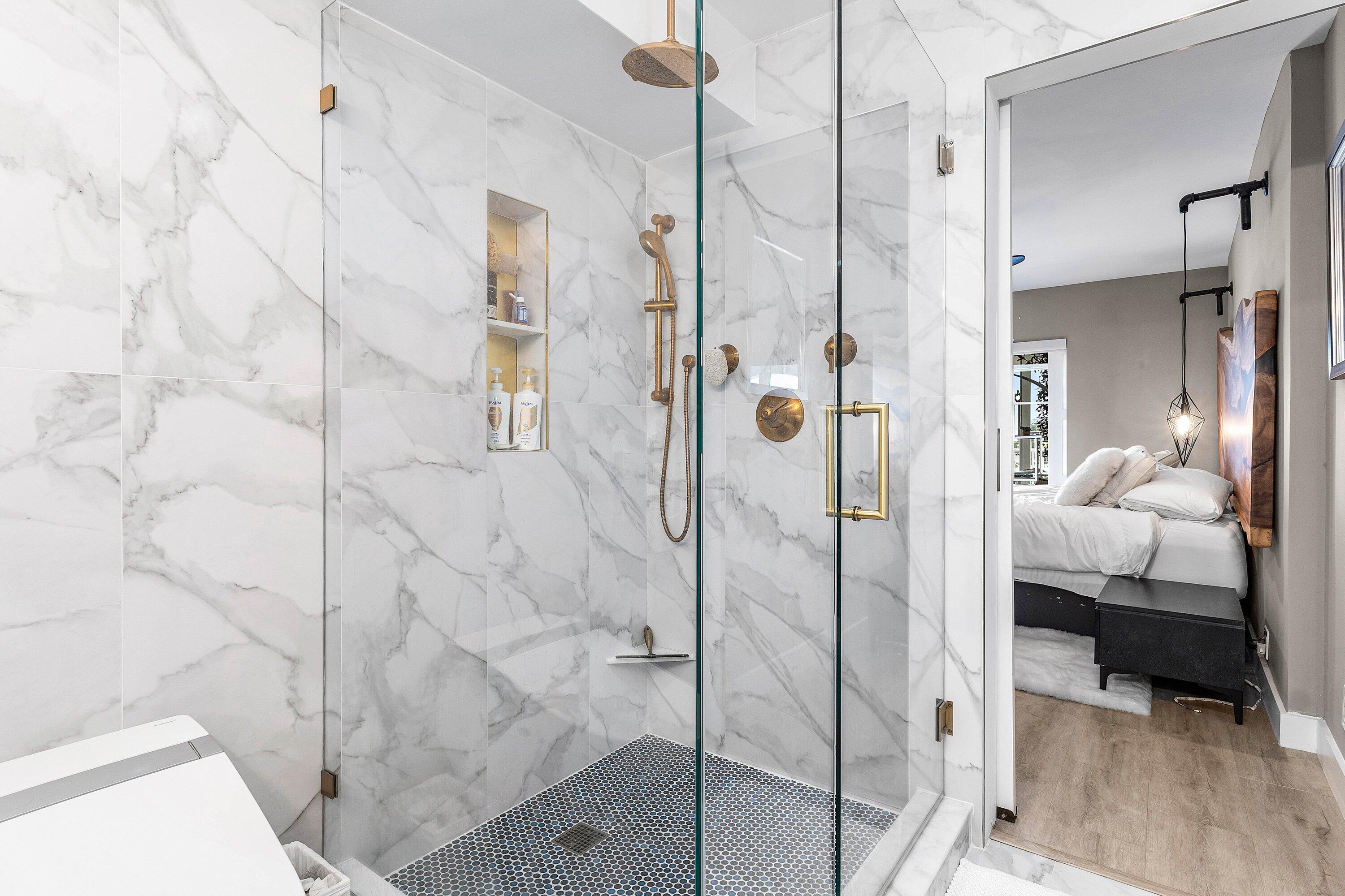 1001 East Camino Real, Unit 4040 Boca Raton, FL 33432 - Photo 21 of 44 a bathroom with a shower