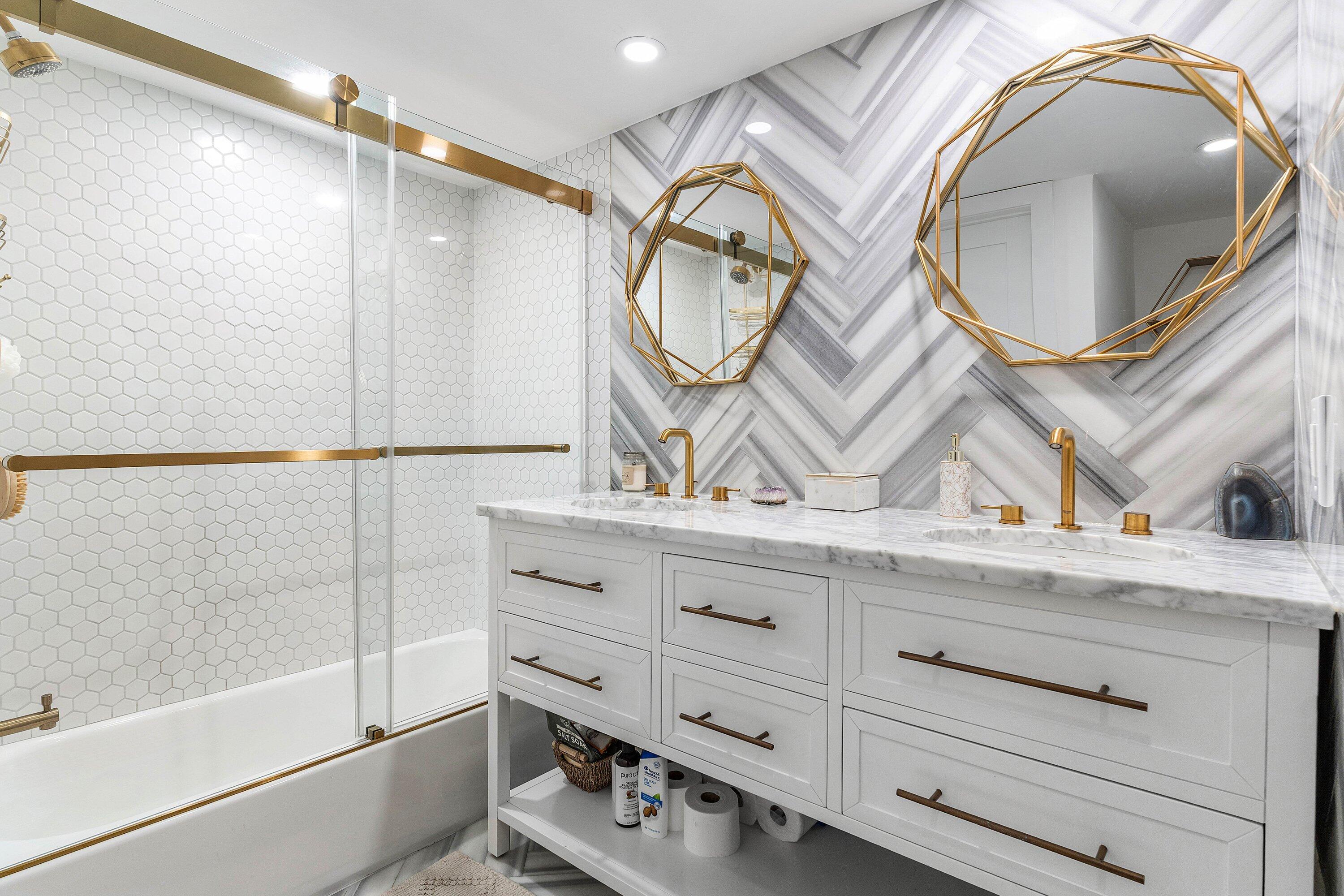 1001 East Camino Real, Unit 4040 Boca Raton, FL 33432 - Photo 25 of 44 a bathroom with a sink and a mirror