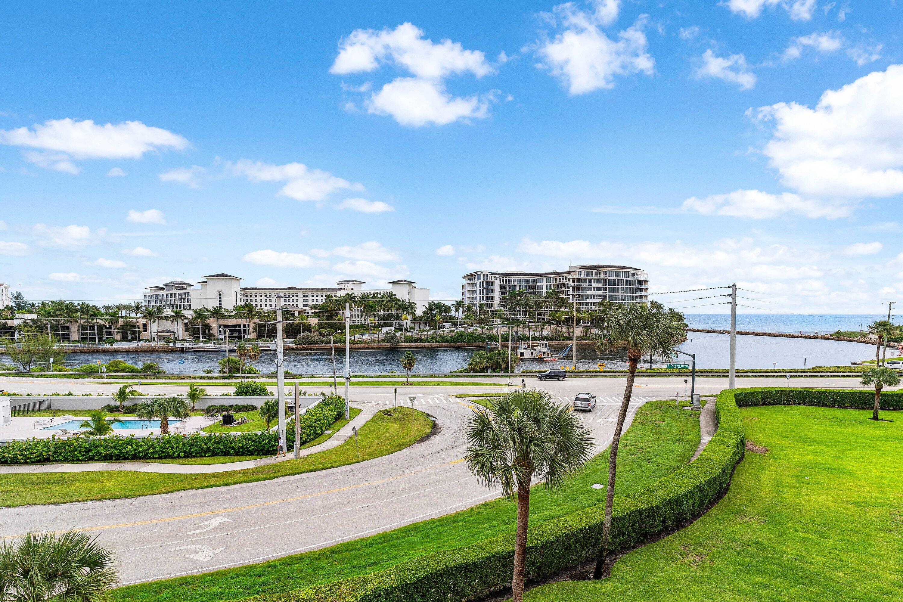 1001 East Camino Real, Unit 4040 Boca Raton, FL 33432 - Photo 34 of 44 a view of a swimming pool with a lake