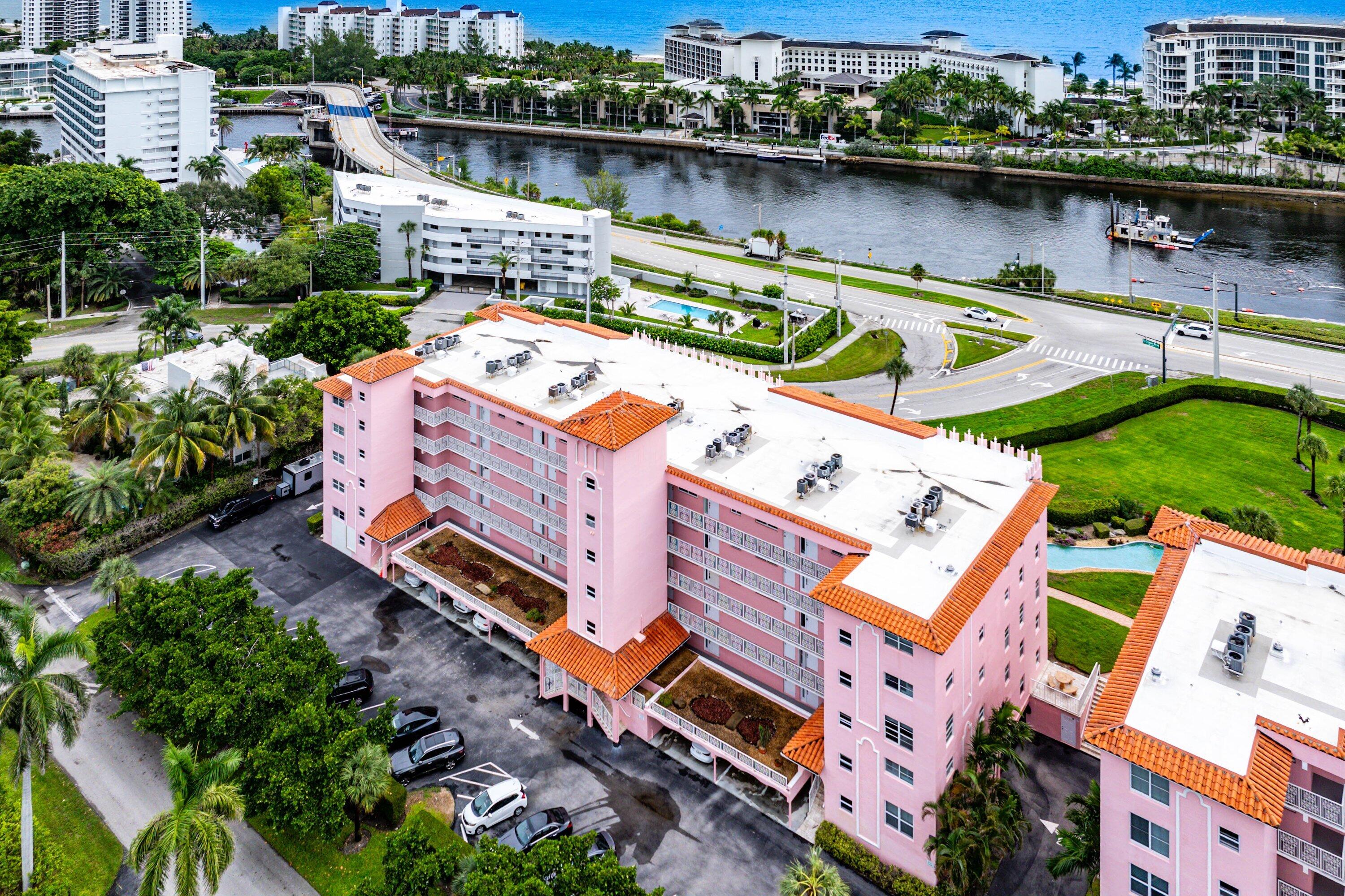 1001 East Camino Real, Unit 4040 Boca Raton, FL 33432 - Photo 38 of 44 an aerial view of a house with a lake view