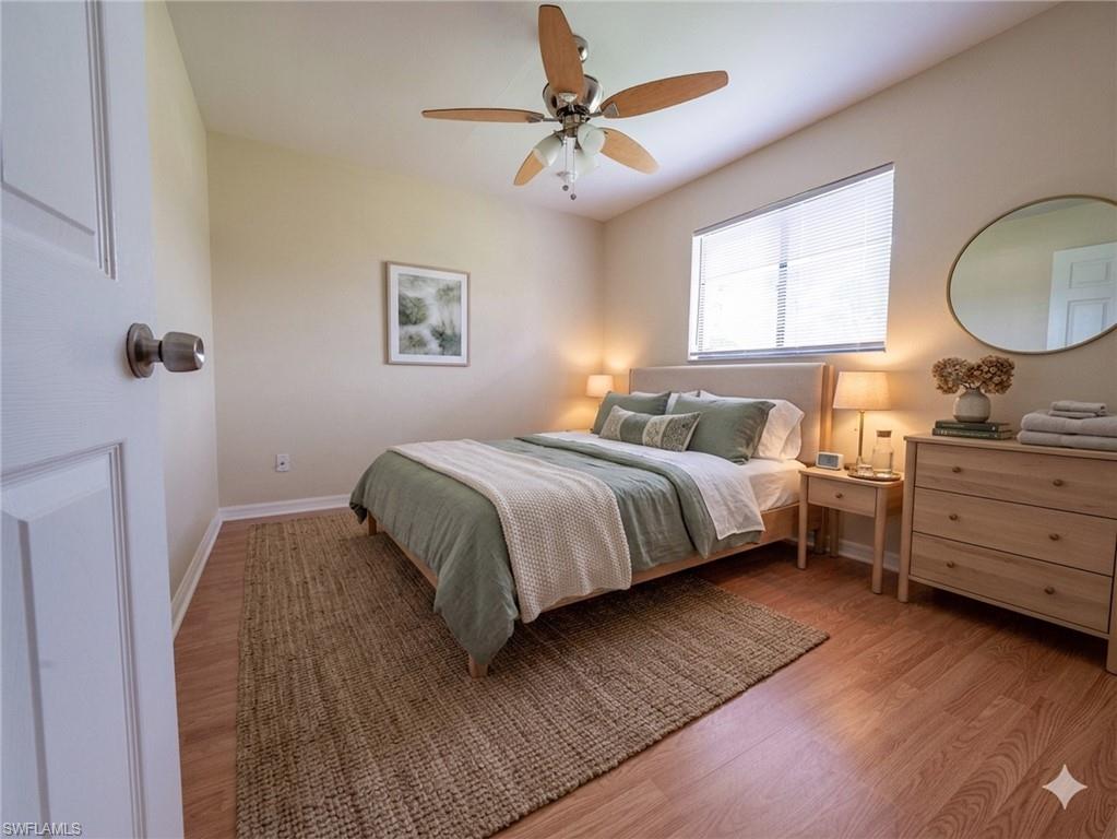18414 Tulip Road Fort Myers, FL 33967 - Photo 24 of 37 Bedroom featuring wood-finish flooring, a ceiling fan with integrated lighting, and a window with blinds