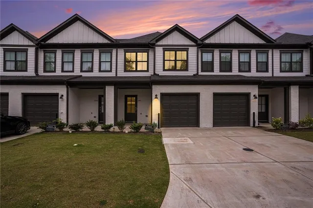 a front view of a house with a yard