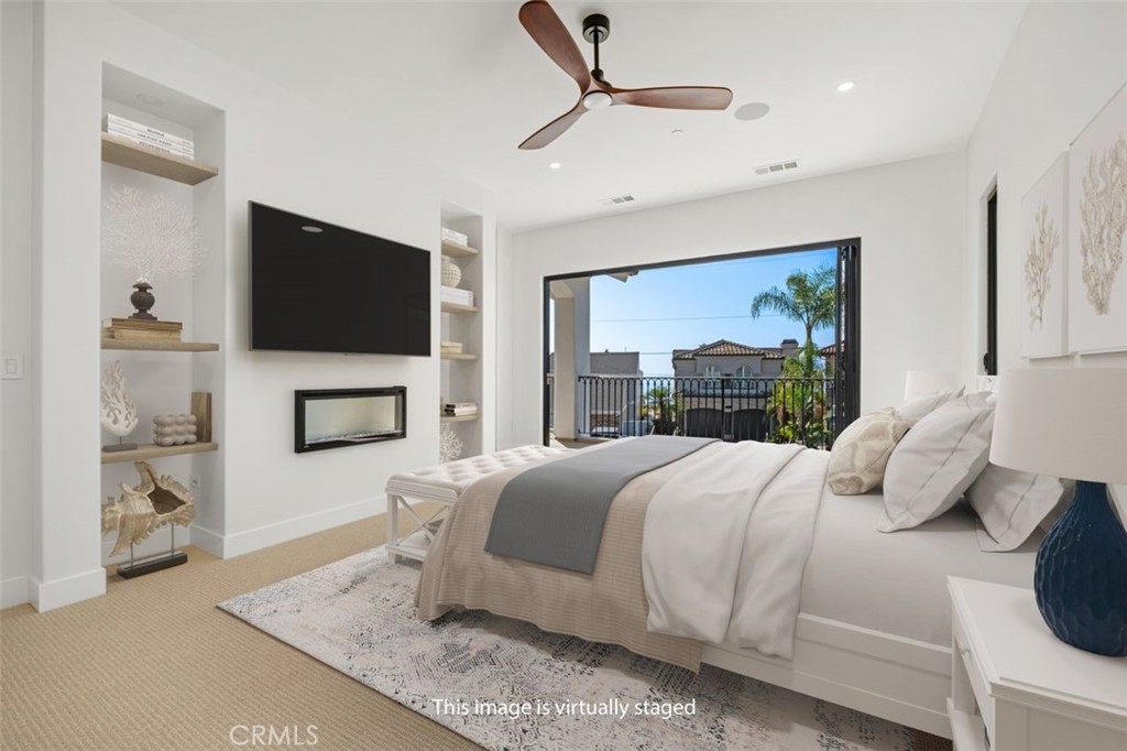 34882 Doheny Place Dana Point, CA 92624 - Photo 11 of 42 a bedroom with a large bed and a flat screen tv