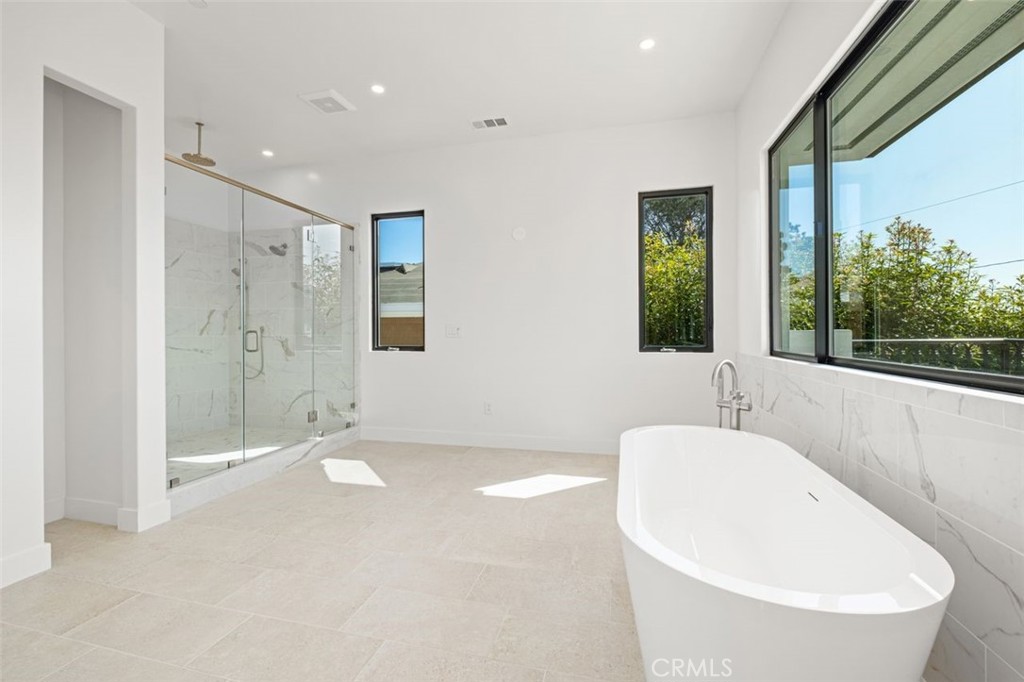 34882 Doheny Place Dana Point, CA 92624 - Photo 13 of 42 a spacious bathroom with a tub shower and sink