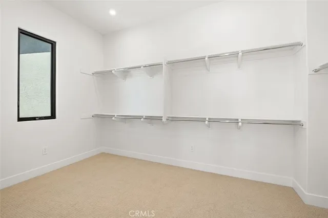 a view of an empty walk in closet