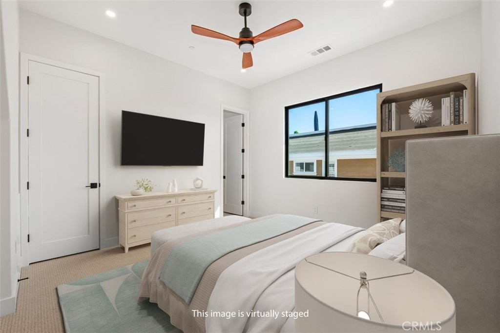 34882 Doheny Place Dana Point, CA 92624 - Photo 18 of 42 a bedroom with a bed tv and window