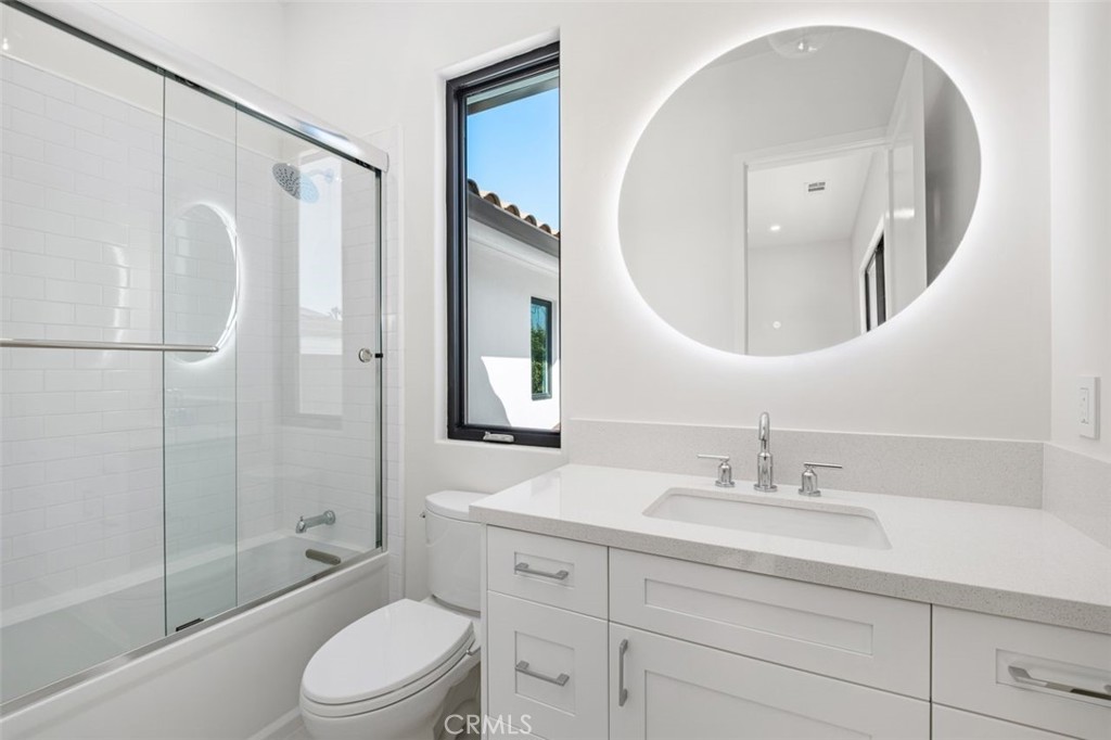 34882 Doheny Place Dana Point, CA 92624 - Photo 19 of 42 a bathroom with a sink a toilet and a mirror