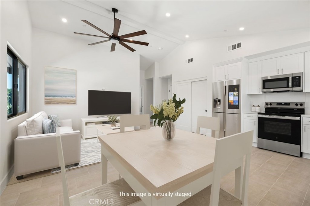 34882 Doheny Place Dana Point, CA 92624 - Photo 27 of 42 a kitchen with stainless steel appliances kitchen island granite countertop a sink and a refrigerator