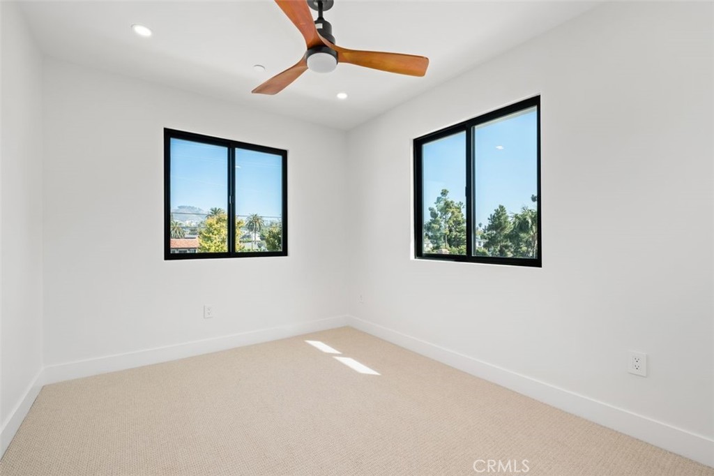 34882 Doheny Place Dana Point, CA 92624 - Photo 29 of 42 an empty room with windows and fan
