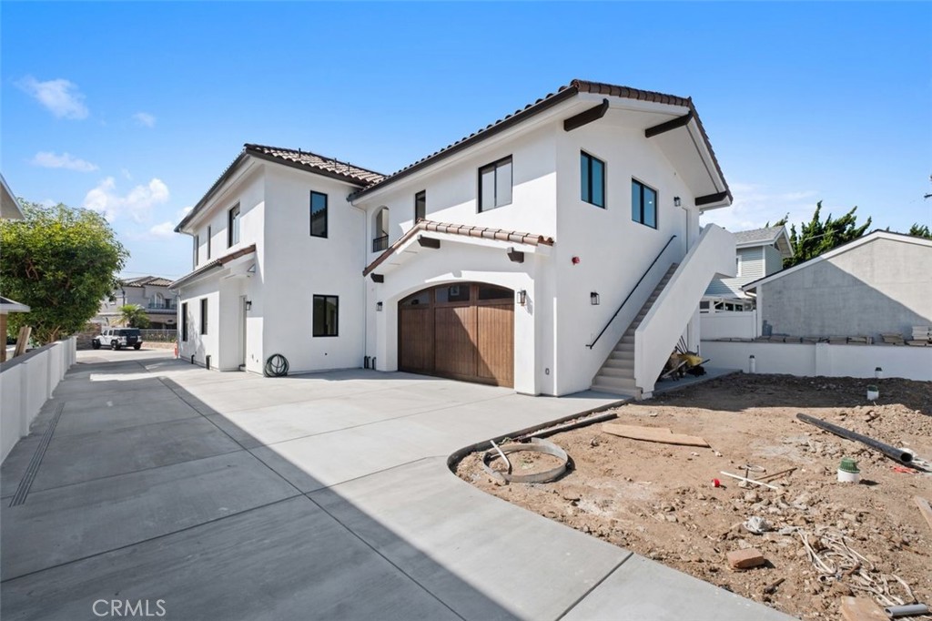 34882 Doheny Place Dana Point, CA 92624 - Photo 31 of 42 a view of a white house with a yard