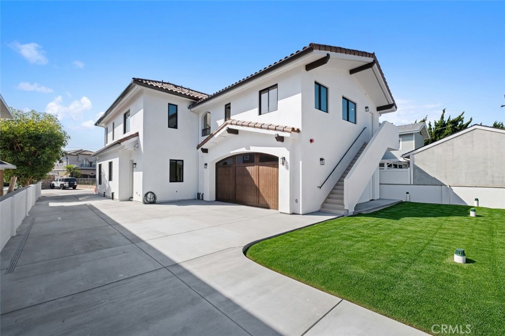34882 Doheny Place Dana Point, CA 92624 - Photo 32 of 42 a front view of a house with a yard