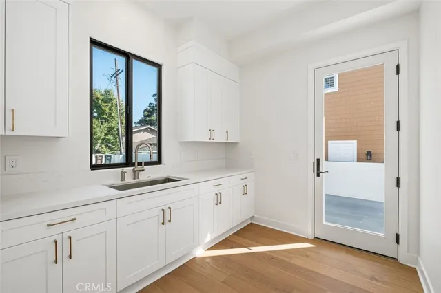 a kitchen with a sink and cabinets