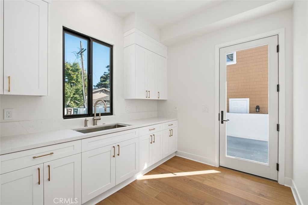 34882 Doheny Place Dana Point, CA 92624 - Photo 8 of 42 a kitchen with a sink and cabinets