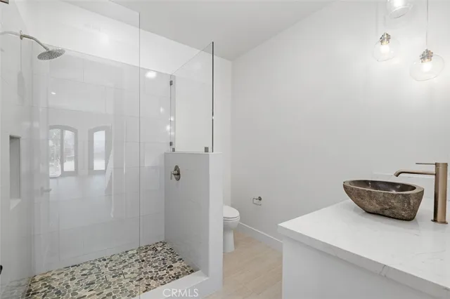 a bathroom with a sink and shower