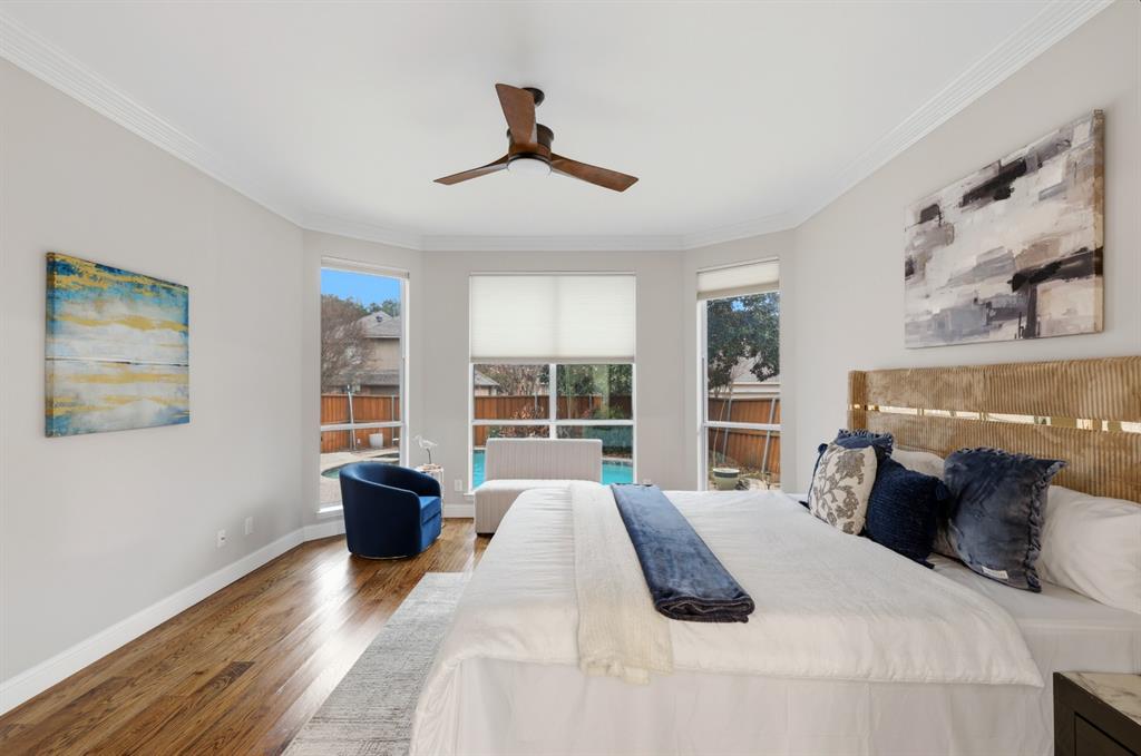 913 Cross Plains Drive Allen, TX 75013 - Photo 16 of 40 a bedroom with a bed and wooden floor