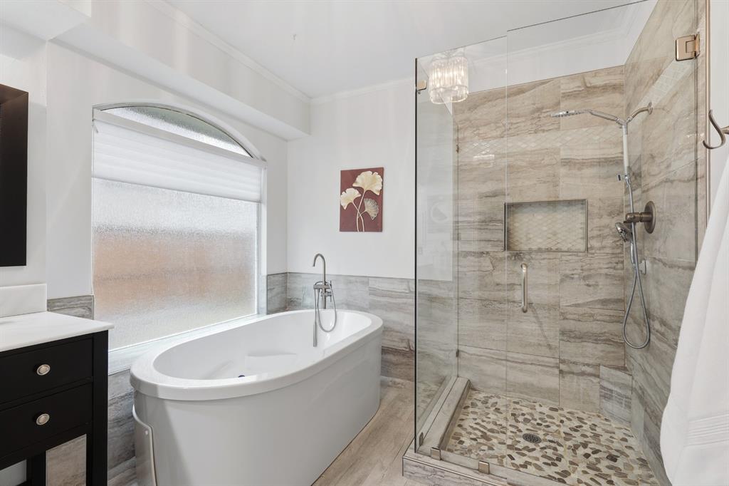 913 Cross Plains Drive Allen, TX 75013 - Photo 20 of 40 a bathroom with a bathtub and a shower