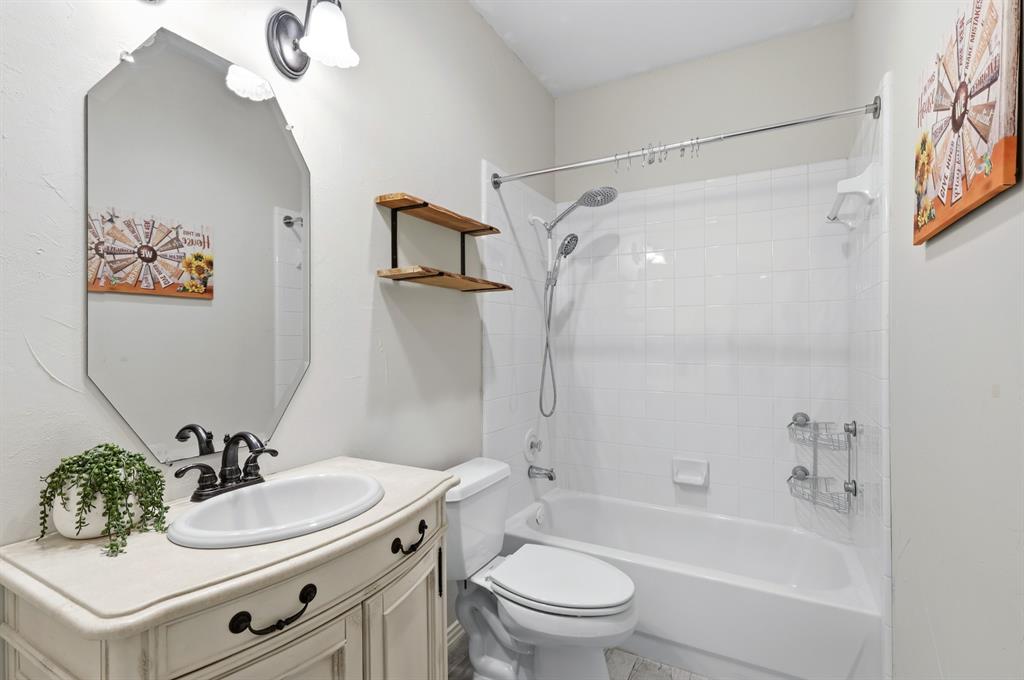 913 Cross Plains Drive Allen, TX 75013 - Photo 23 of 40 a bathroom with a sink toilet and shower