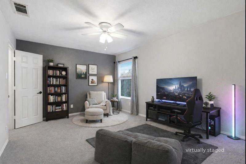 913 Cross Plains Drive Allen, TX 75013 - Photo 31 of 40 a living room with furniture and a flat screen tv